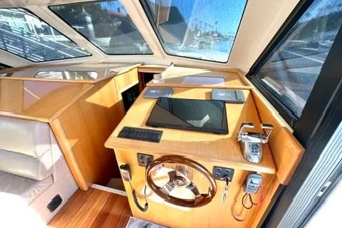 Slide: The Image of 2007 Maritimo 52 yacht helm with modern controls and panoramic windows. - 9