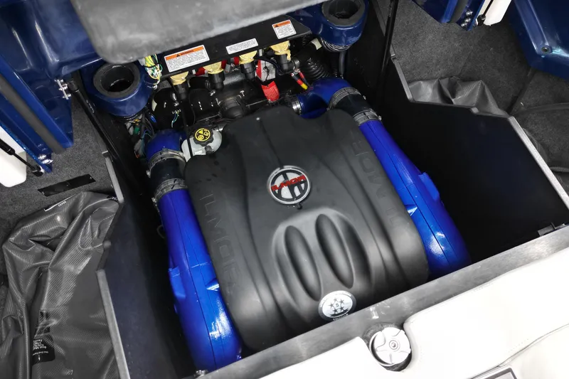 Slide: The Image of 2023 MasterCraft X24 engine compartment with Ilmor engine, featuring blue components. - 12