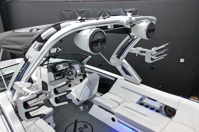 Slide: The Image of 2023 MasterCraft X24 boat interior with advanced dashboard and sleek seating design. - 14