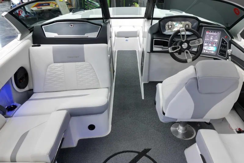 Slide: The Image of 2023 MasterCraft X24 boat interior with modern dashboard and luxurious seating. - 9