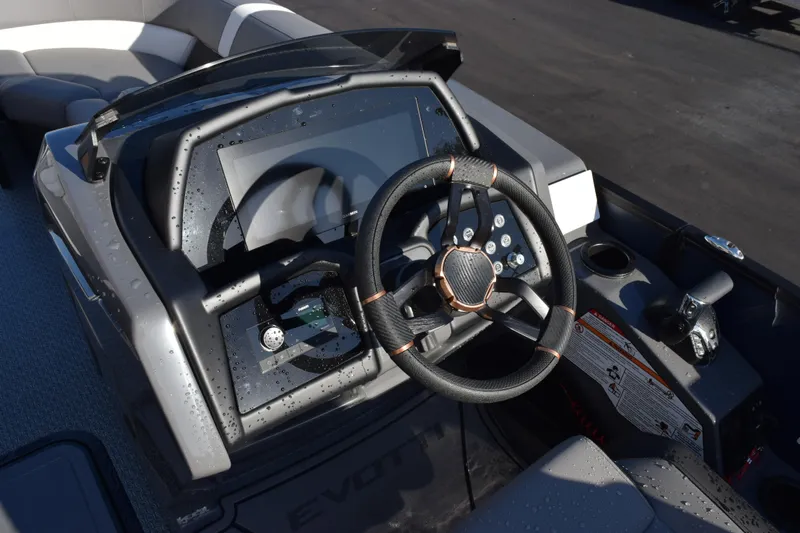 Slide: The Image of Steering console of 2026 Evotti 723QL boat with modern controls and sleek design. - 11