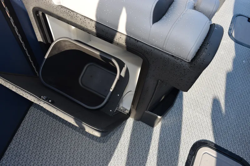 Slide: The Image of Evotti 723QL 2026 boat interior with open storage compartment and cushioned seating. - 12