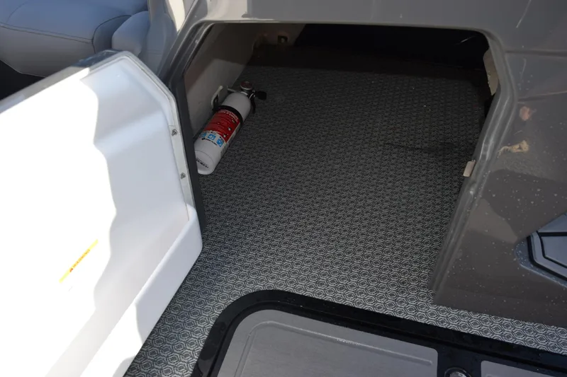 Slide: The Image of Open storage compartment in Evotti 723QL 2026 with fire extinguisher inside. - 17