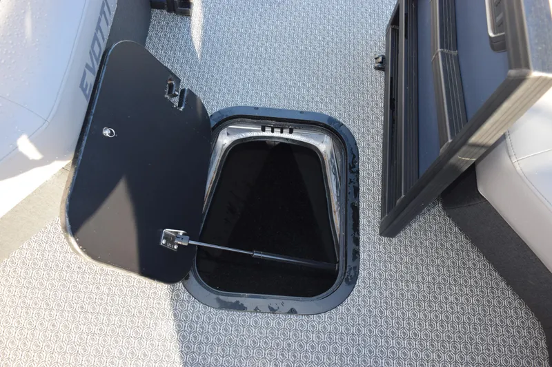 Slide: The Image of Open storage compartment on 2026 Evotti 723QL boat with patterned flooring. - 18