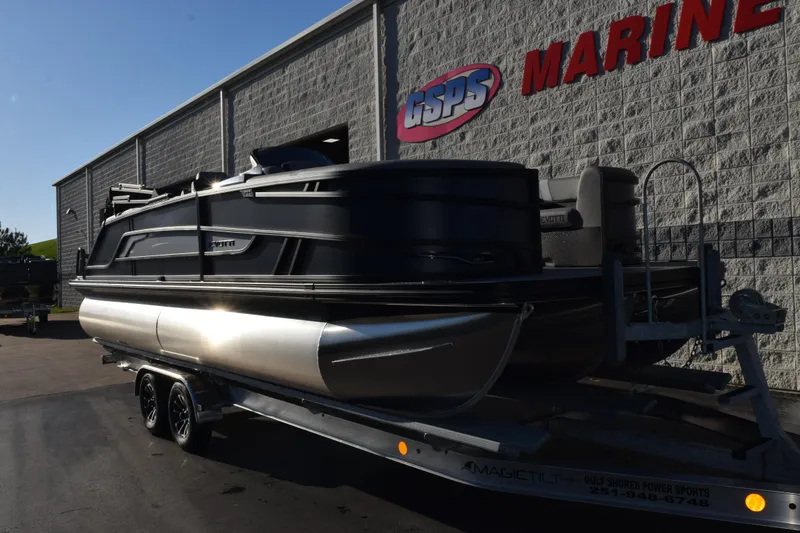 Slide: The Image of 2026 Evotti 723QL pontoon boat on trailer outside GSPS Marine building. - 2