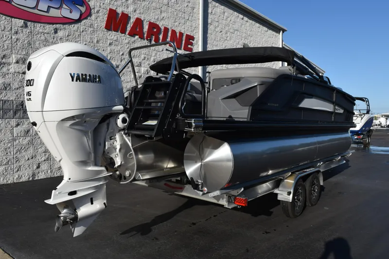 Slide: The Image of 2026 Evotti 723QL pontoon boat with Yamaha V6 engine, parked at a marine dealership. - 4