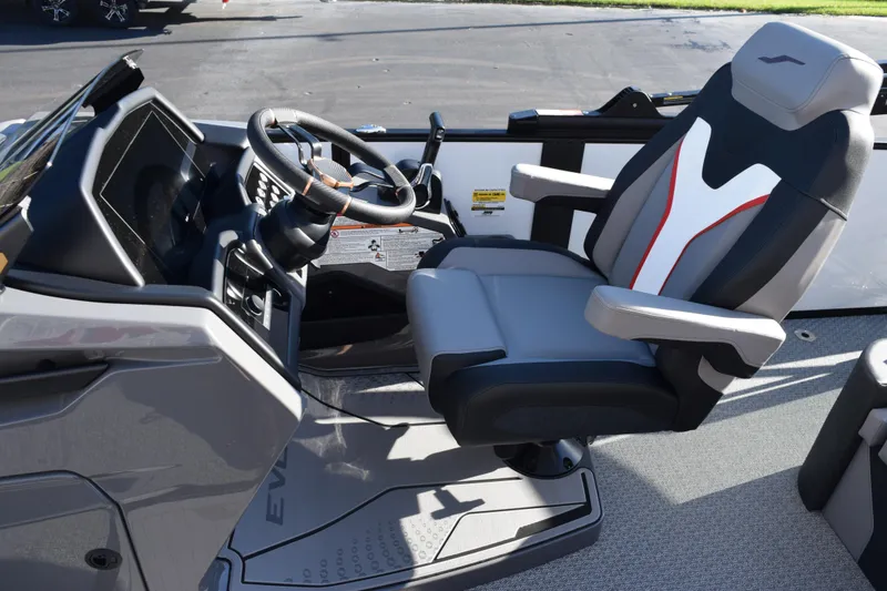 Slide: The Image of Captain's seat and helm of 2026 Evotti 721CS boat, featuring modern controls. - 14