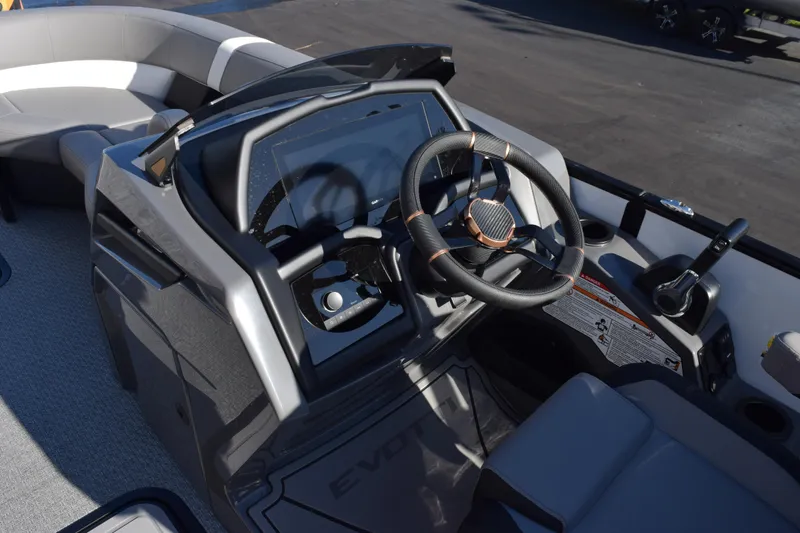 Slide: The Image of Steering console of 2026 Evotti 721CS boat with modern controls and seating. - 15