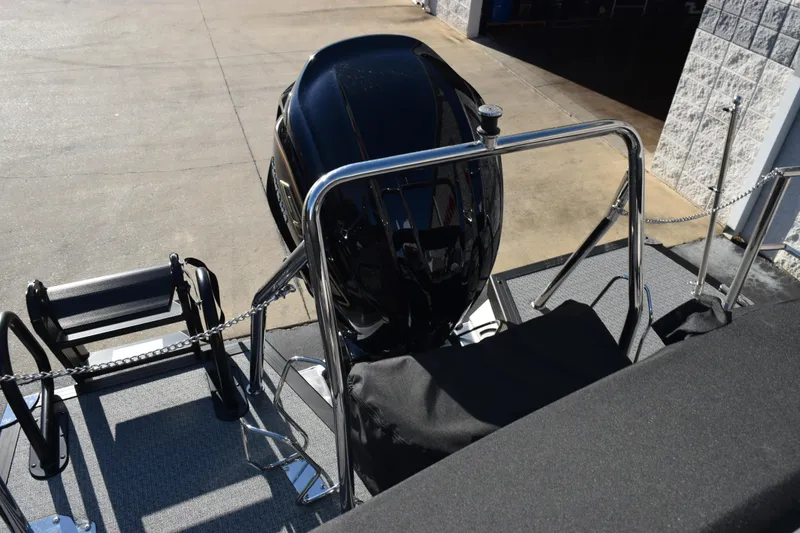 Slide: The Image of Rear view of 2026 Evotti 721CS boat with outboard motor and ladder. - 19