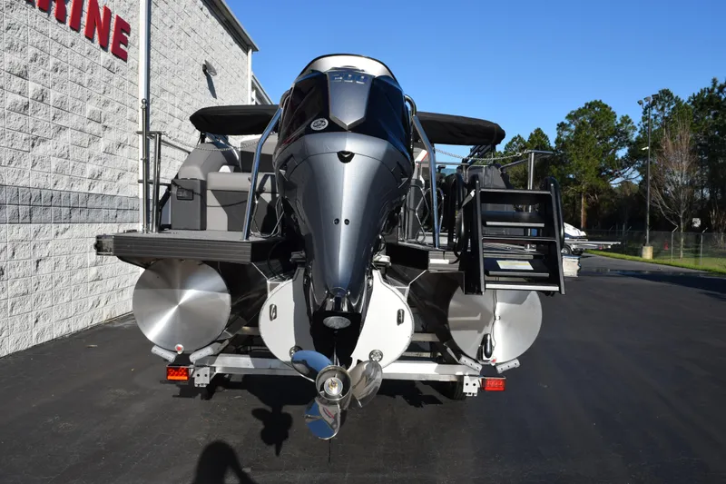 Slide: The Image of 2026 Evotti 721CS boat with sleek design, parked outdoors near a building. - 5