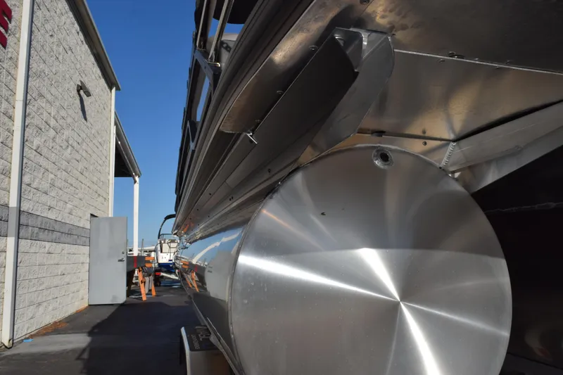 Slide: The Image of 2026 Evotti 721CS boat, metallic finish, parked beside a building under clear blue sky. - 8