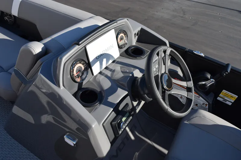 Slide: The Image of 2026 Evotti 521CS boat dashboard with steering wheel and Garmin display. - 11