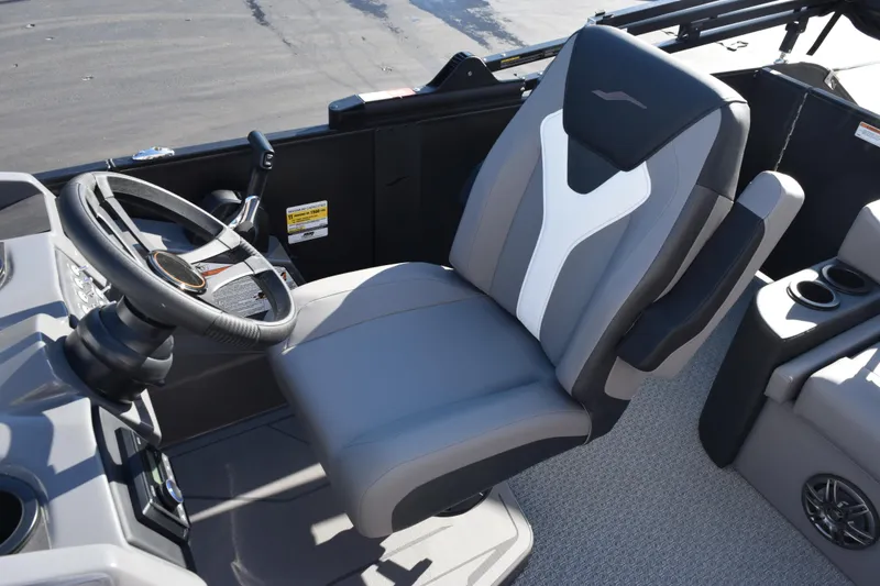 Slide: The Image of Captain's seat and steering wheel of 2026 Evotti 521CS boat, featuring modern design and controls. - 12