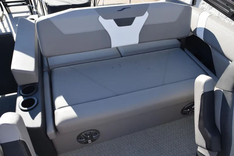 Slide: The Image of 2026 Evotti 521CS boat interior with gray seating and cup holders. - 13