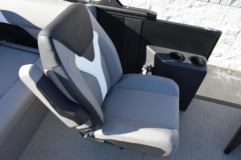 Slide: The Image of Gray and black seat in 2026 Evotti 521CS boat, featuring dual cup holders. - 14