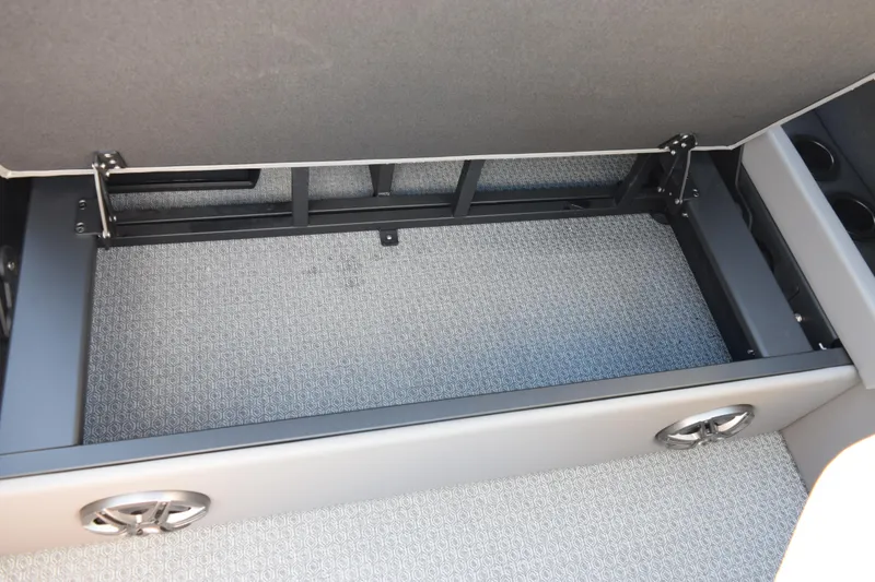 Slide: The Image of Open storage compartment in 2026 Evotti 521CS vehicle, showcasing interior design and functionality. - 18