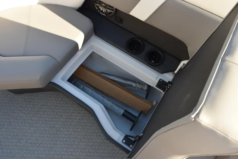 Slide: The Image of Interior storage compartment of 2026 Evotti 521CS boat with cup holders and accessories. - 21