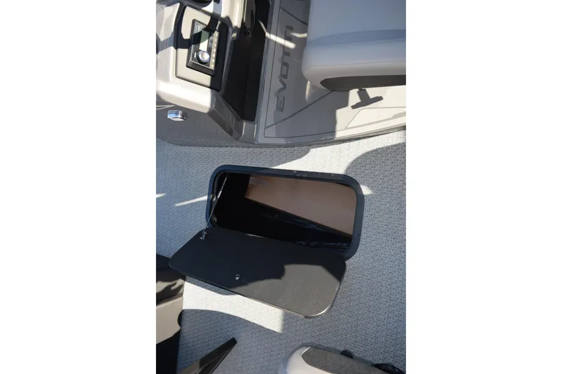 Slide: The Image of Open storage compartment on 2026 Evotti 521CS boat interior. - 22