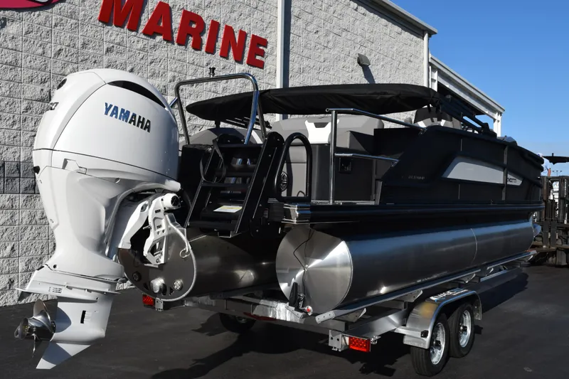 Slide: The Image of 2026 Evotti 521CS pontoon boat with Yamaha engine, parked outside a marine store. - 4
