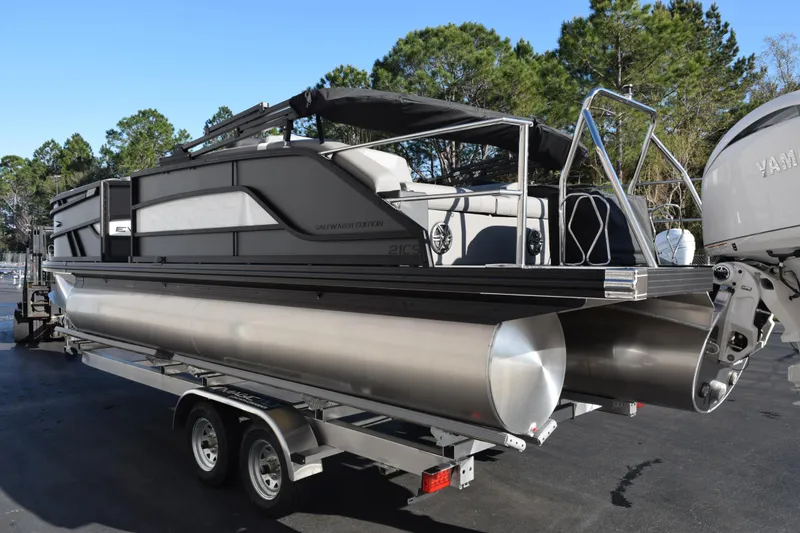 Slide: The Image of 2026 Evotti 521CS pontoon boat on trailer, featuring sleek design and Yamaha engine. - 6