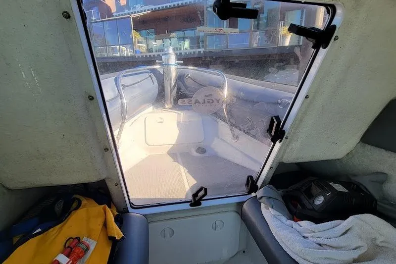 Slide: The Image of Interior view of a 2000 Protector 28 Targa boat, showing seating and equipment. - 17