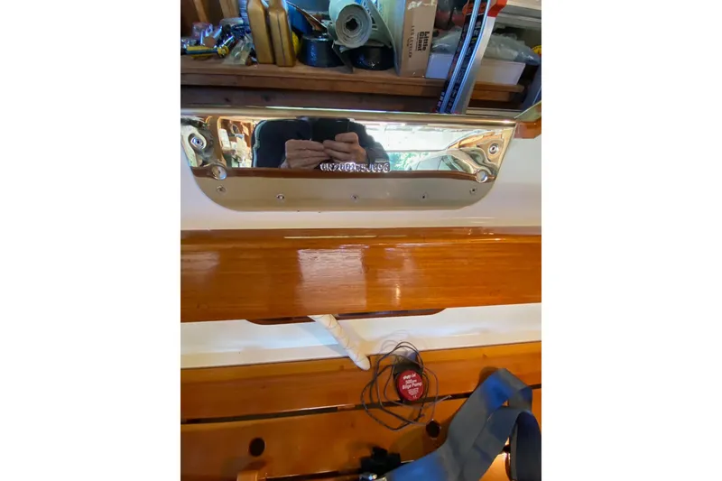 Slide: The Image of Polished metal surface with reflection, surrounded by wooden elements and tools, Custom Don 1996. - 17