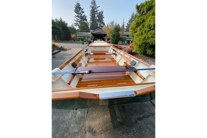 Slide: The Image of Custom 1996 Don boat with wooden interior, parked outdoors near trees and shrubs. - 20