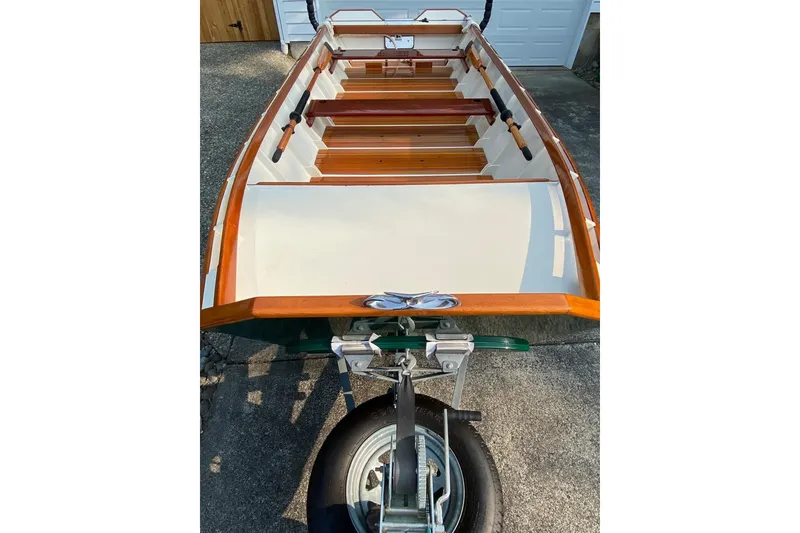 Slide: The Image of Custom 1996 Don boat on trailer, featuring wooden interior and sleek design. - 21