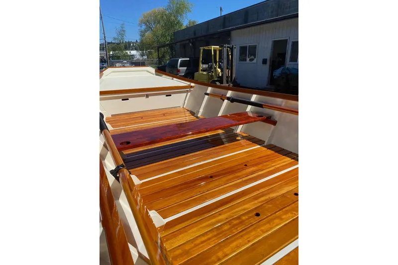 Slide: The Image of Wooden interior of a 1996 Custom Don boat with polished finish. - 4
