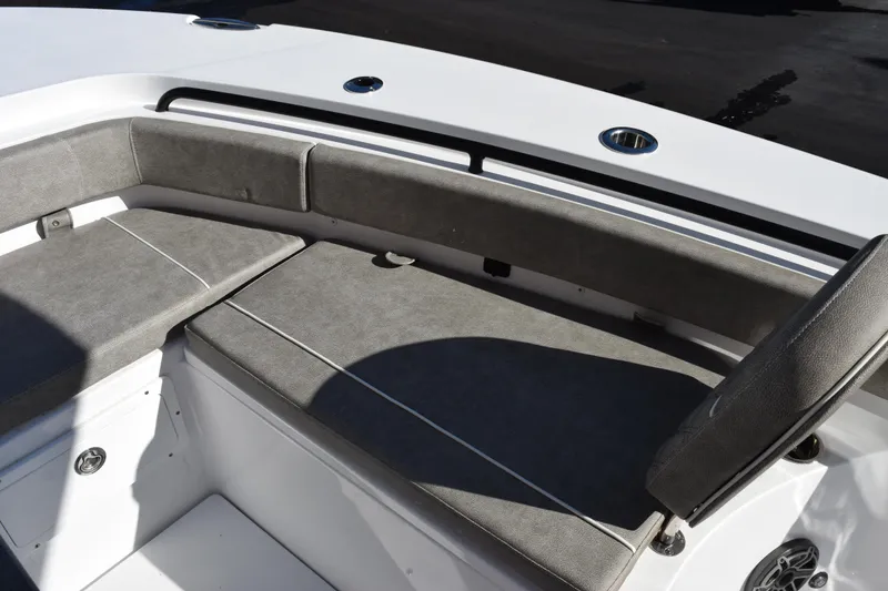 Slide: The Image of 2026 Sea Hunt Gamefish 25 boat interior with cushioned seating and storage compartments. - 13