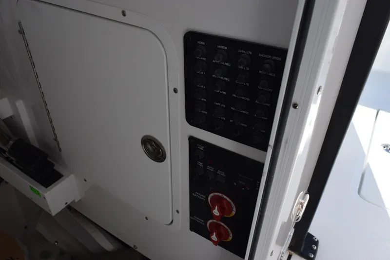 Slide: The Image of Control panel on a 2026 Sea Hunt Gamefish 25 boat interior. - 17