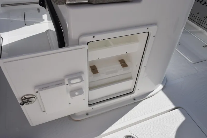 Slide: The Image of Open storage compartment on 2026 Sea Hunt Gamefish 25 boat deck. - 19