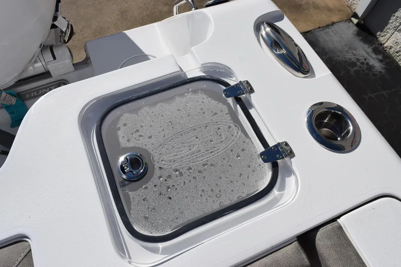 Slide: The Image of 2026 Sea Hunt Gamefish 25 boat deck with wet storage compartment and cup holders. - 20