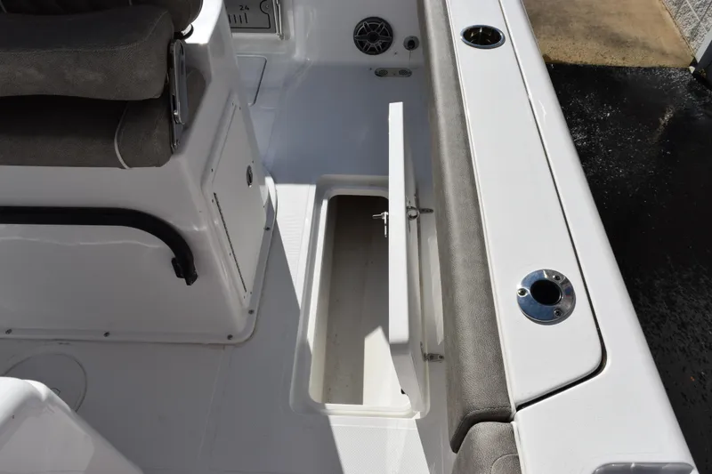 Slide: The Image of 2026 Sea Hunt Gamefish 25 boat interior with open storage compartment. - 22