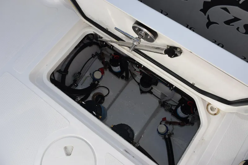 Slide: The Image of Open hatch of 2026 Sea Hunt Gamefish 25 showing internal components and wiring. - 24