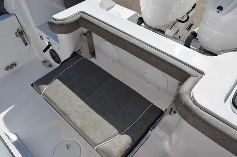 Slide: The Image of 2026 Sea Hunt Gamefish 25 boat interior with cushioned seating and dual engines. - 25