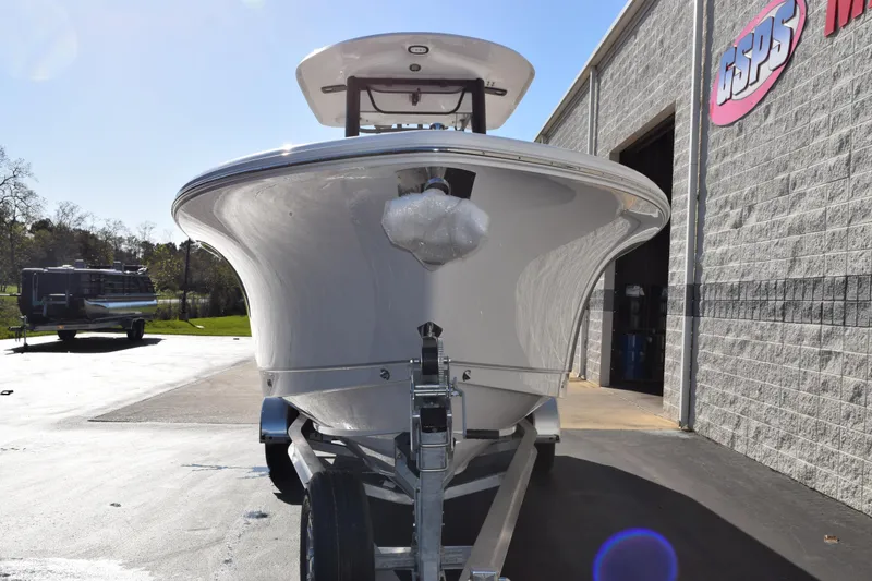 Slide: The Image of 2026 Sea Hunt Gamefish 25 boat on trailer outside dealership. - 3