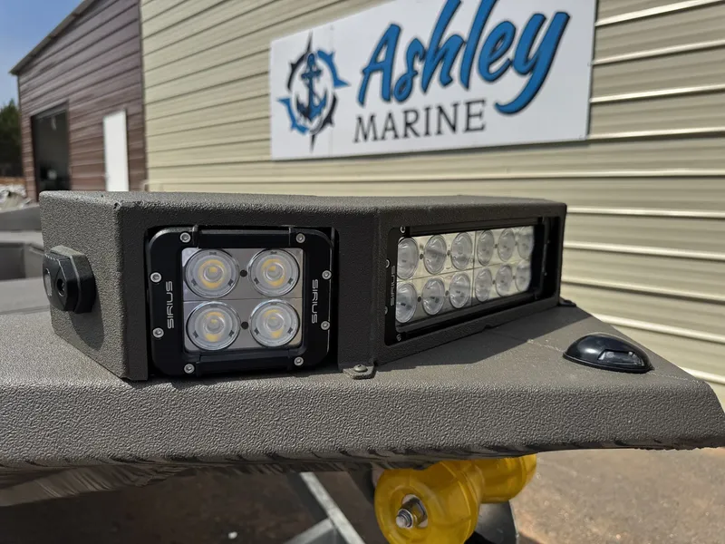 Slide: The Image of Reaper Boats 656 STEP TRANSOM 2026 with LED lights at Ashley Marine. - 2