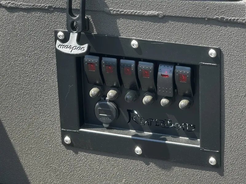 Slide: The Image of Control panel of a 2026 Reaper Boats 550. - 7