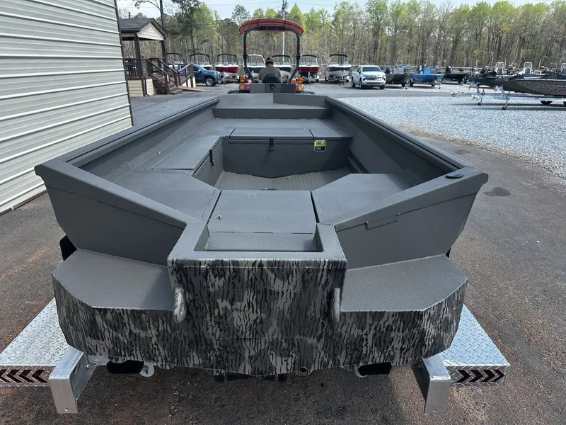 Slide: The Image of Reaper Boats 656 STEP TRANSOM 2026 on trailer, gray design. - 3