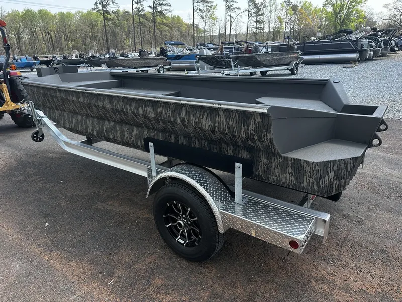 Slide: The Image of Reaper Boats 656 STEP TRANSOM 2026 on trailer outdoors. - 4