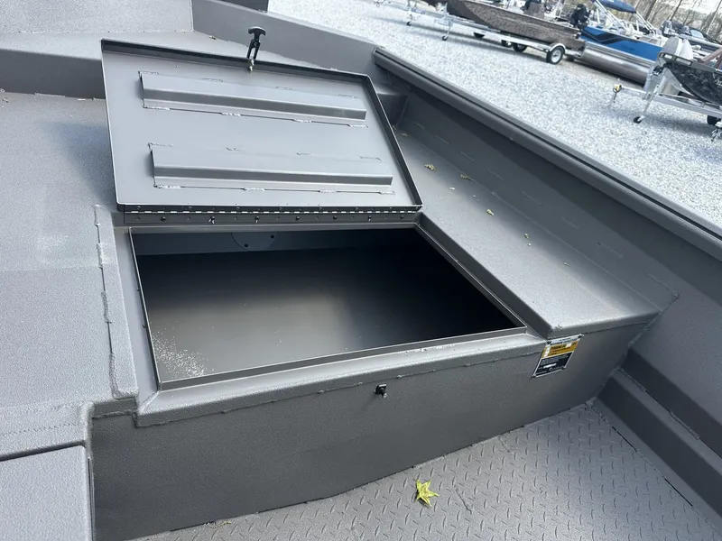 Slide: The Image of Reaper Boats 656 STEP TRANSOM 2026 with open storage compartment. - 6