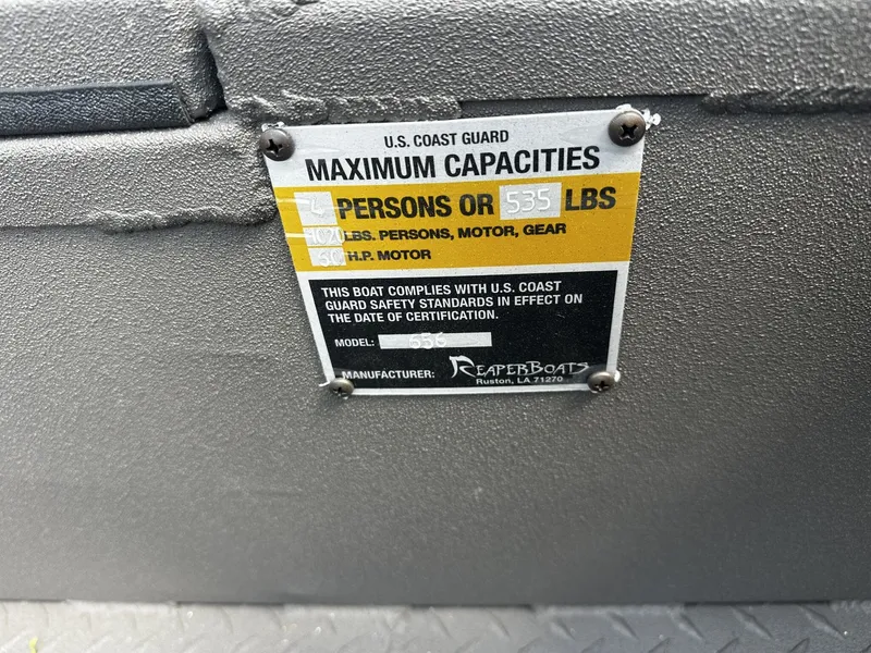 Slide: The Image of US Coast Guard capacity label on Reaper Boats 656 STEP TRANSOM 2026. - 9