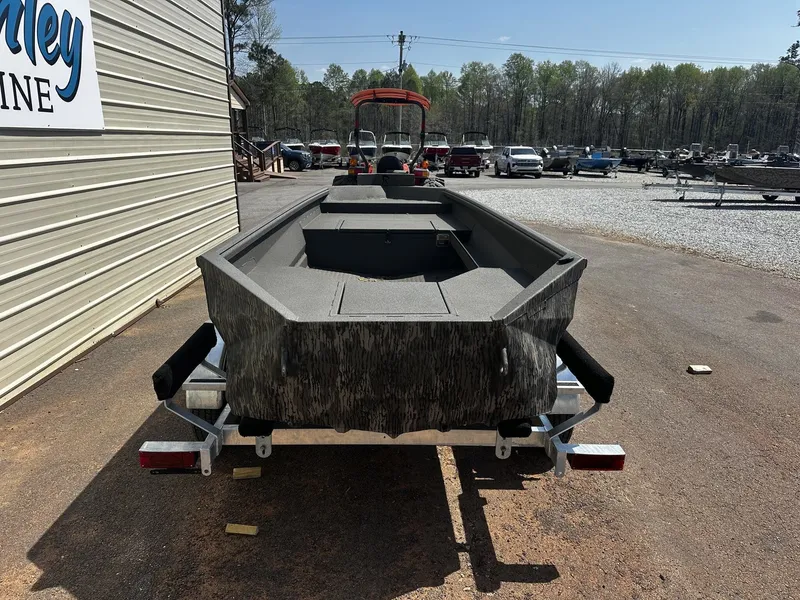 Slide: The Image of Reaper Boats 550 from 2026 on a trailer outdoors. - 6