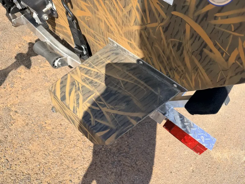 Slide: The Image of G3 Gator Tough 17 SC-70HP boat with camouflage pattern and trailer. - 6