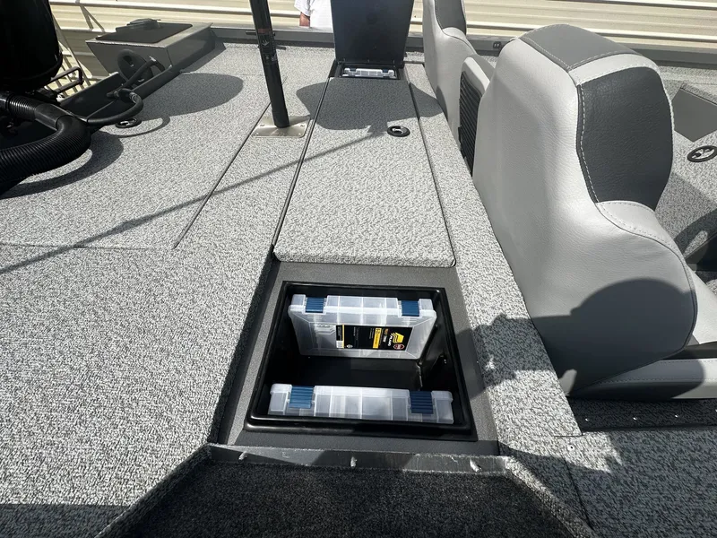 Slide: The Image of 2026 G3 Sportsman 1810 boat with storage compartment and seating area. - 7