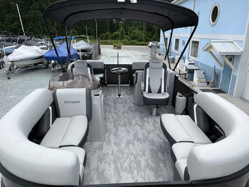 Slide: The Image of Interior view of 2026 Sylvan X-1 DH pontoon boat with gray seating. - 5