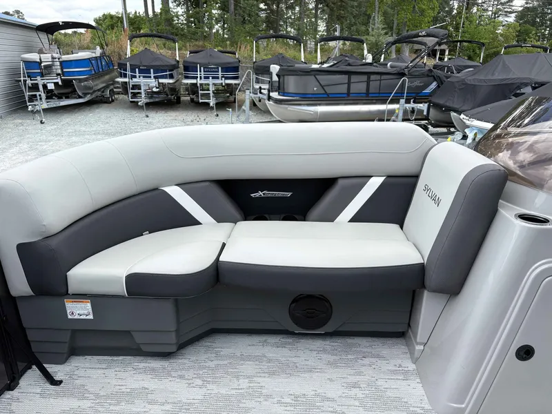 Slide: The Image of Sylvan X-1 DH 2026 boat seating with gray upholstery. - 6