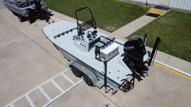 Slide: The Image of 2024 Majek 21RFL boat with Suzuki engine on trailer. - 13