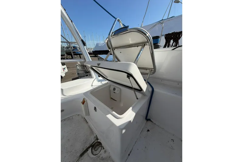 Slide: The Image of Open storage compartment on 2022 Seawind 1160 Lite catamaran with diesel motors. - 10